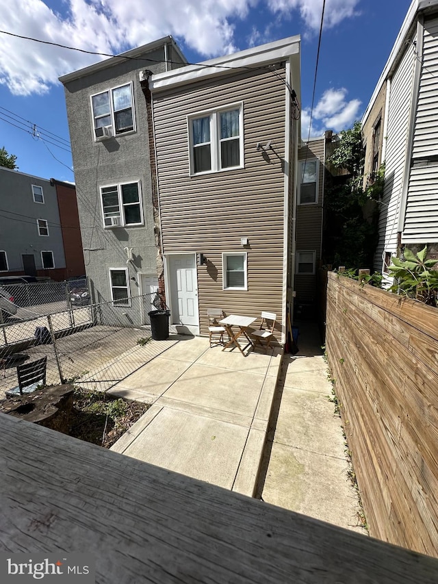 rear view of property featuring a patio area