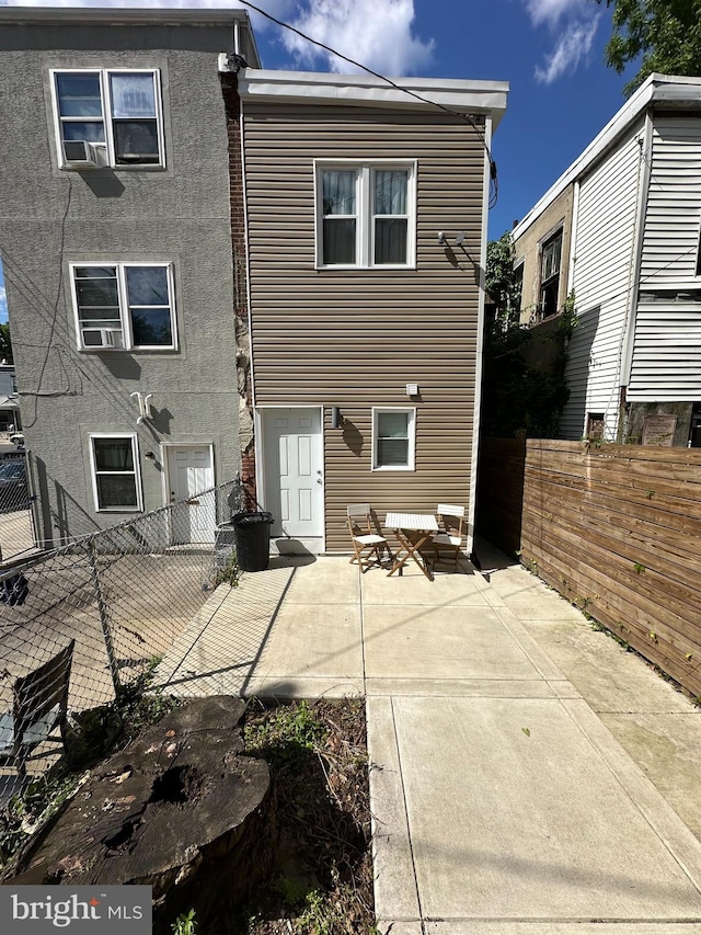 rear view of property featuring a patio