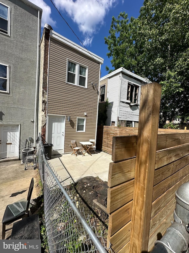 rear view of property with a patio area