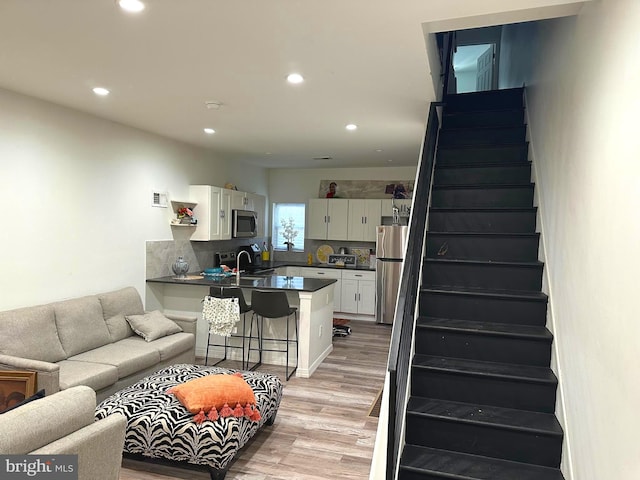 living room with light hardwood / wood-style floors