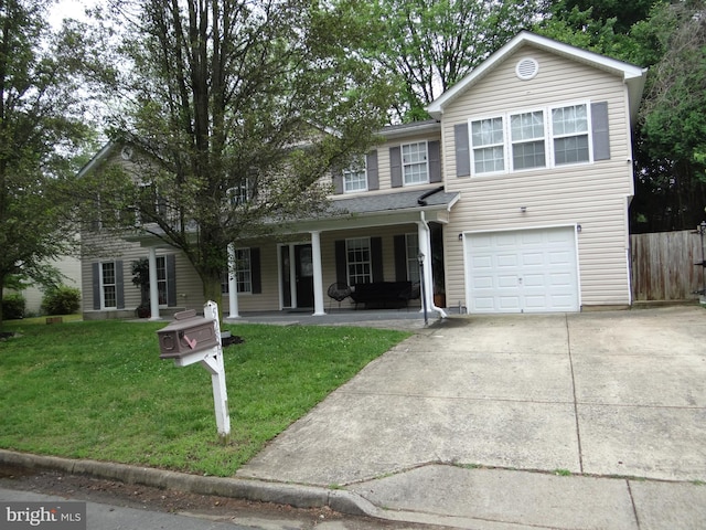 view of front of property with a front yard and a garage