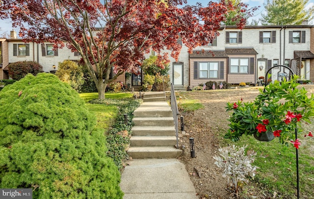 view of front of home featuring brick siding