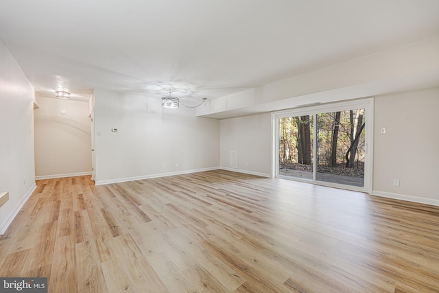 spare room featuring light hardwood / wood-style floors