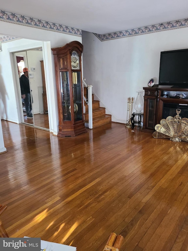 living room with dark hardwood / wood-style floors