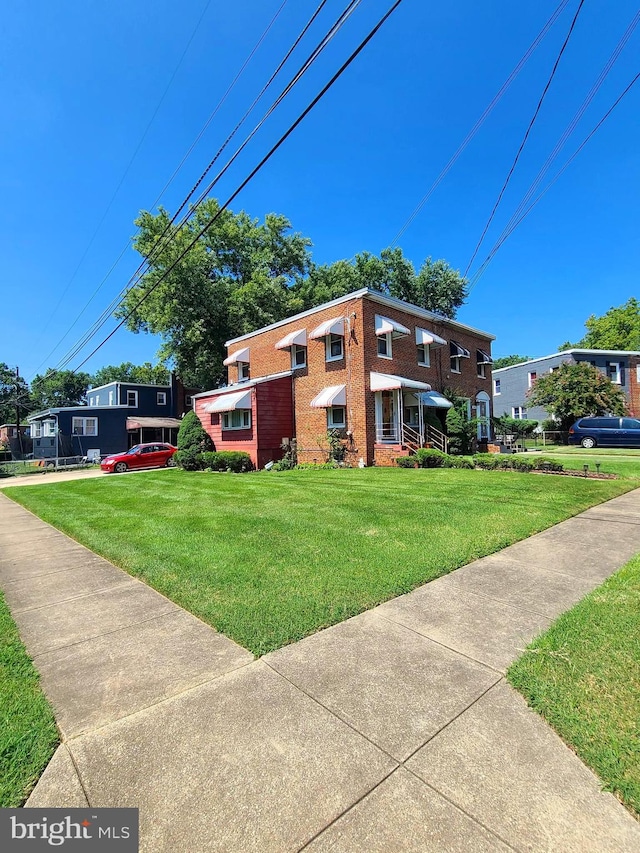 view of home's exterior with a yard