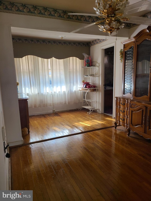 unfurnished dining area with wood-type flooring