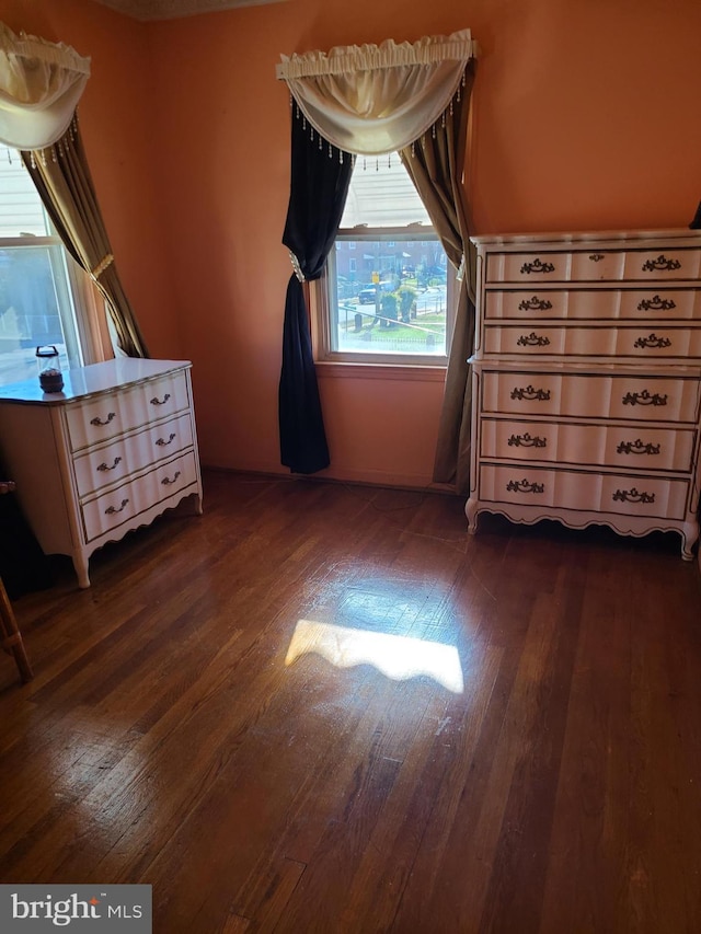 unfurnished bedroom featuring dark hardwood / wood-style flooring