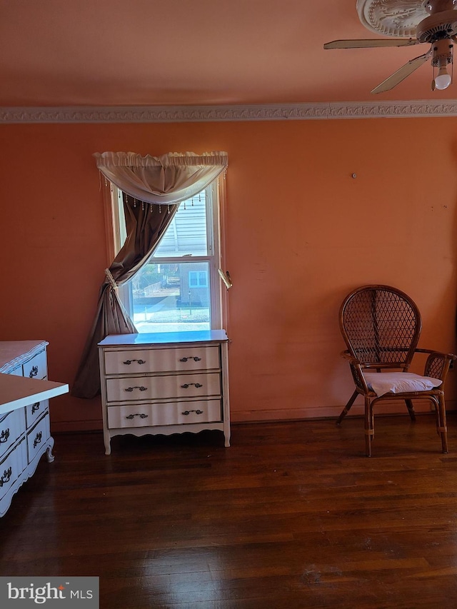 sitting room with dark hardwood / wood-style floors and ceiling fan