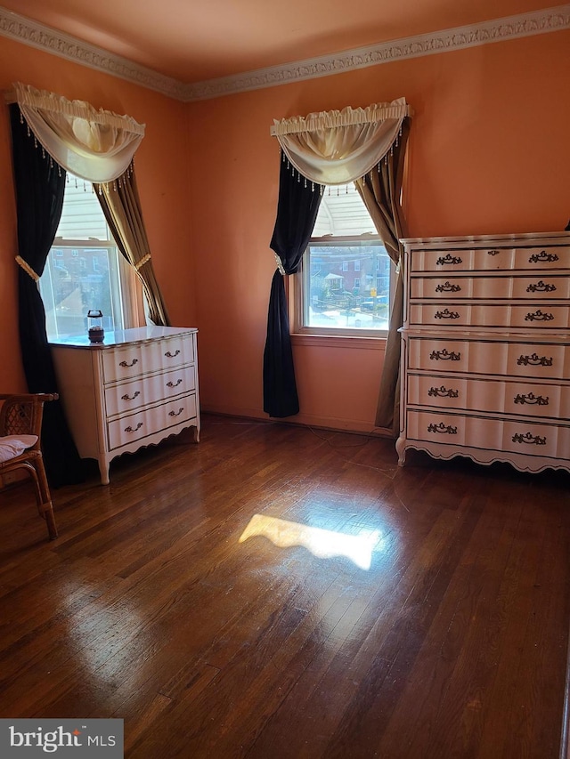 unfurnished bedroom with dark hardwood / wood-style flooring