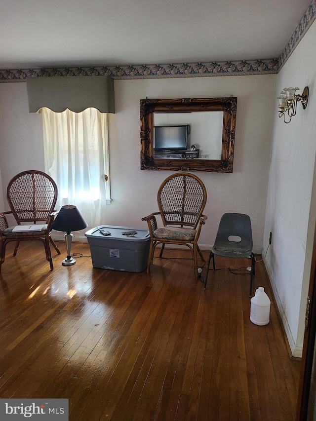 sitting room with hardwood / wood-style floors