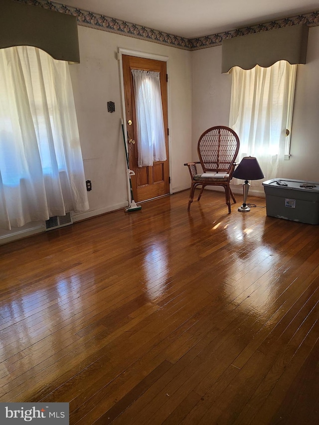 entryway with hardwood / wood-style flooring