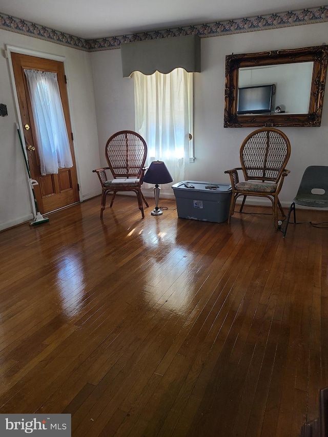 living area with wood-type flooring