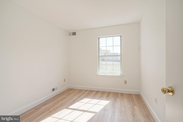 unfurnished room with light hardwood / wood-style flooring