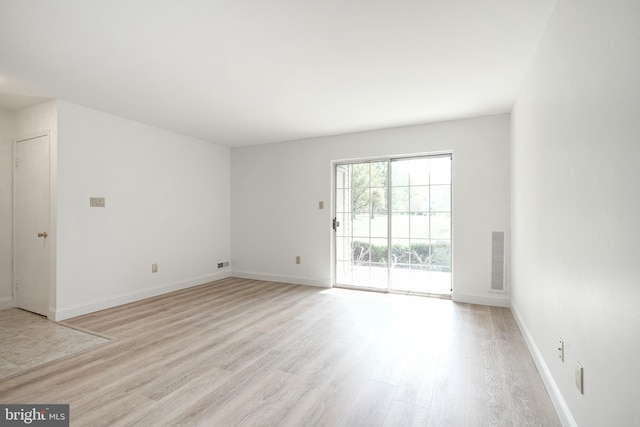 unfurnished room featuring light hardwood / wood-style floors