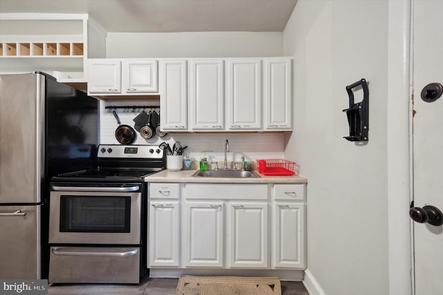 kitchen featuring white cabinets, sink, and stainless steel appliances