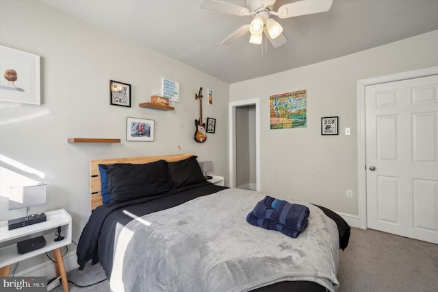 bedroom with ceiling fan and carpet flooring