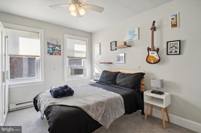 carpeted bedroom featuring cooling unit, a baseboard heating unit, and ceiling fan