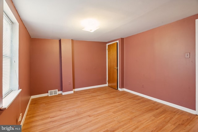 empty room featuring hardwood / wood-style floors