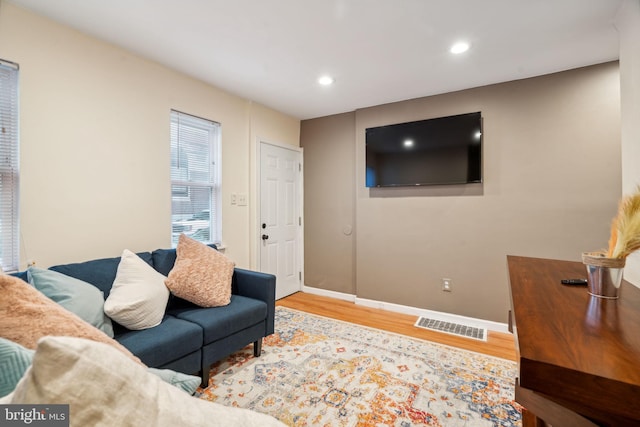 living room with light hardwood / wood-style flooring