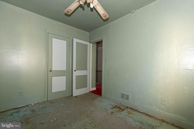 unfurnished bedroom featuring ceiling fan