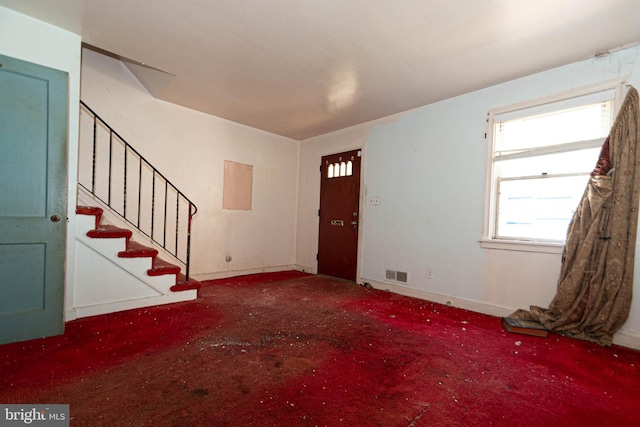 view of carpeted foyer