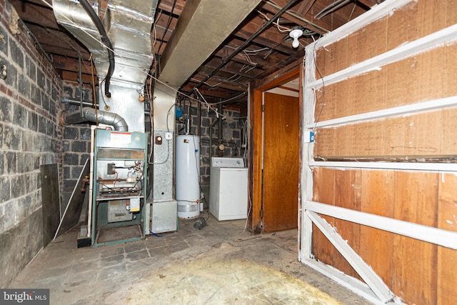 basement featuring gas water heater and washer / clothes dryer