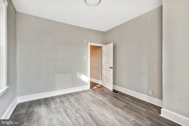 spare room featuring hardwood / wood-style flooring