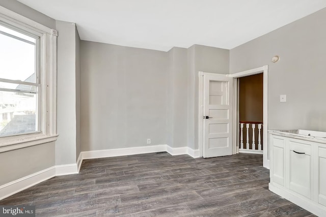 empty room featuring dark hardwood / wood-style flooring