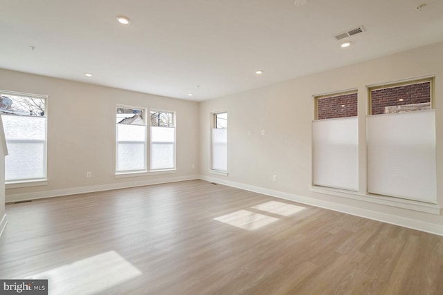 spare room featuring light hardwood / wood-style flooring