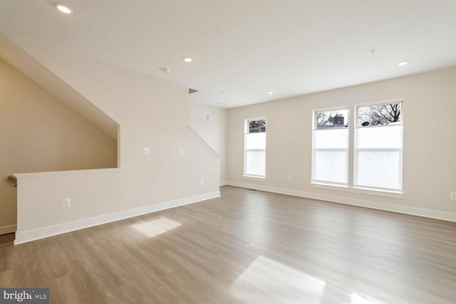 unfurnished living room with light hardwood / wood-style floors