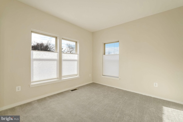 unfurnished room with carpet flooring