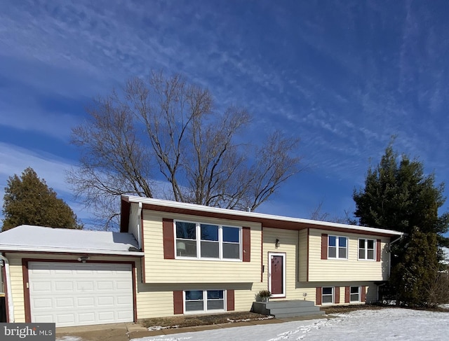 bi-level home featuring a garage