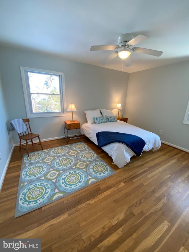 bedroom with wood-type flooring and ceiling fan