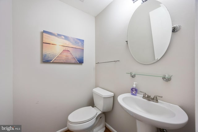 bathroom with sink and toilet