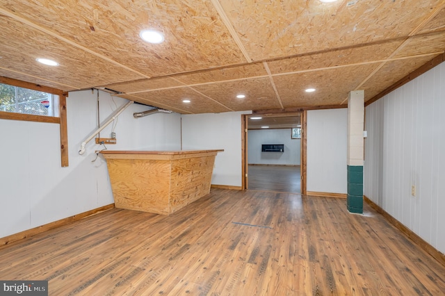 interior space with wooden walls and wood-type flooring