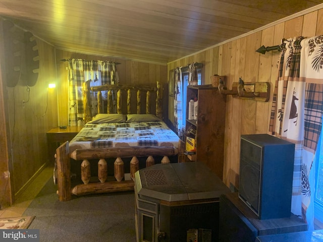 bedroom with wood ceiling and wood walls