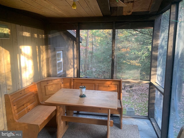 sunroom with wooden ceiling and a wealth of natural light