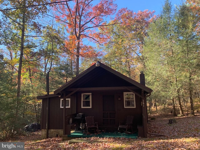 view of property exterior with a porch