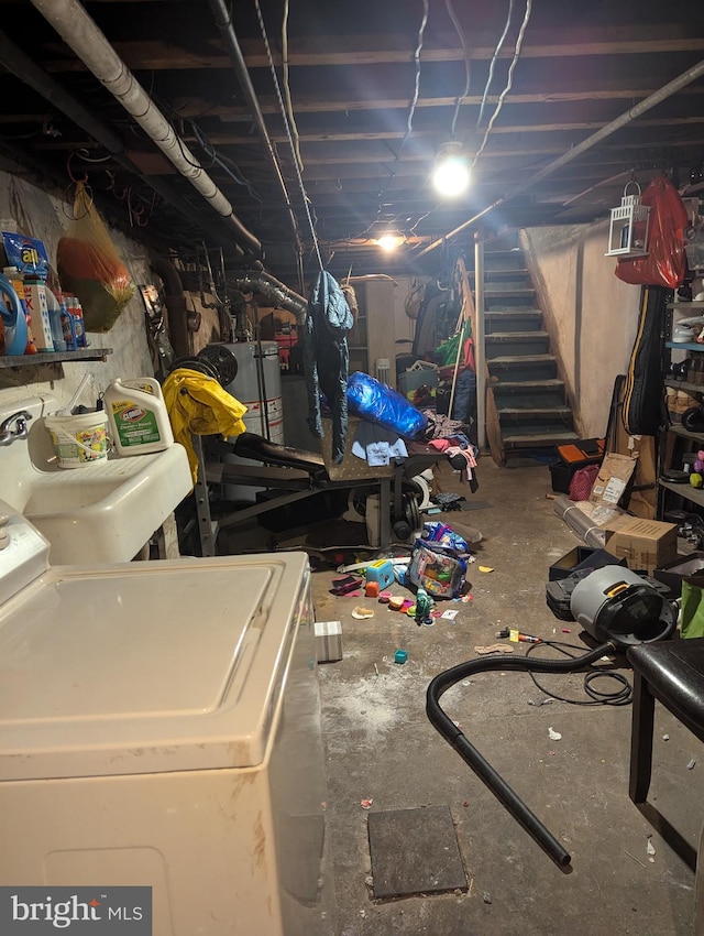 basement featuring washer / dryer and gas water heater