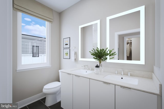 bathroom with vanity, toilet, and tile patterned flooring