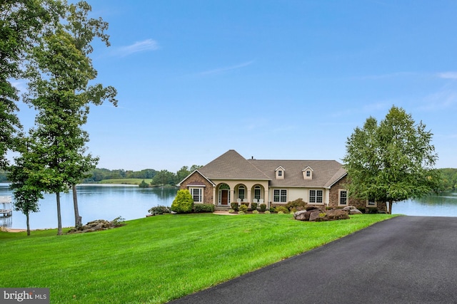 view of front of home featuring a water view and a front yard