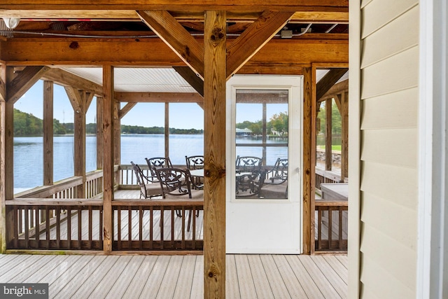 wooden deck featuring a water view