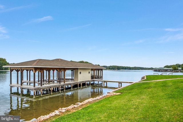 view of dock featuring a yard and a water view