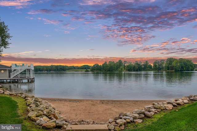 property view of water with a dock