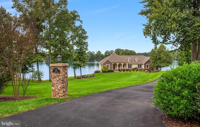 view of front of house featuring a water view and a front yard