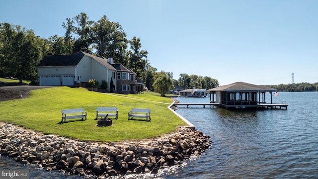 dock area featuring a yard and a water view