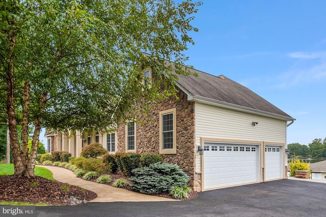 view of property exterior featuring a garage