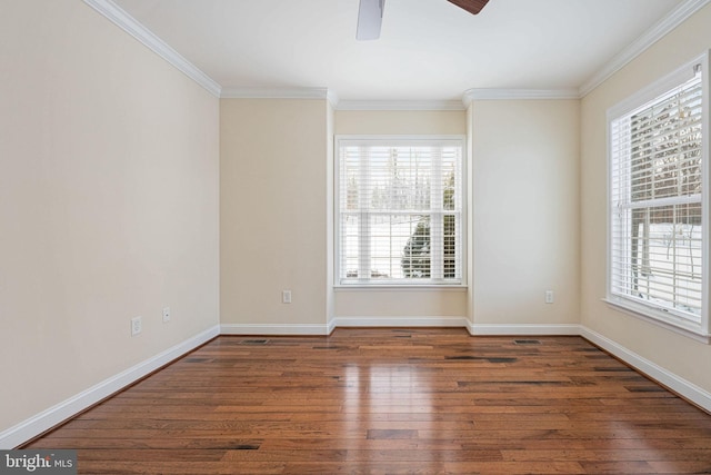 empty room featuring ornamental molding, ceiling fan, and dark wood-type flooring