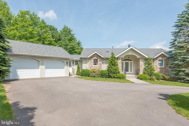 ranch-style home featuring a garage