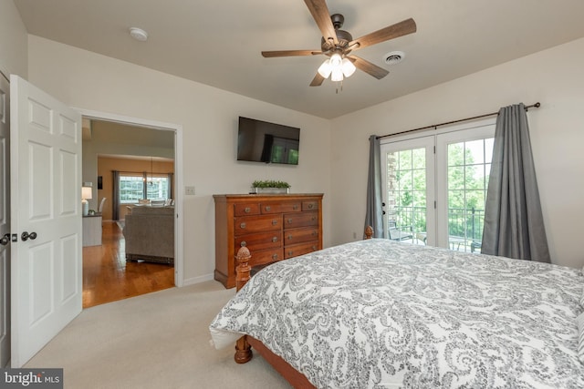 carpeted bedroom with access to outside and ceiling fan